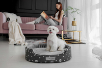 Owalne legowisko kojec dla psa Welsti ciemny szary srebrne kości i łapki M 58x47 antypoślizgowy