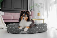 Owalne legowisko kojec dla psa Welsti ciemny szary srebrne kości i łapki XL 80x67 antypoślizgowy